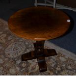 A Titchmarsh & Goodwin Circular Oak Lamp or Wine Table, raised on a baluster turned support and