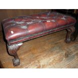 Red leather upholstered stool on carved cabriole legs with ball & claw feet