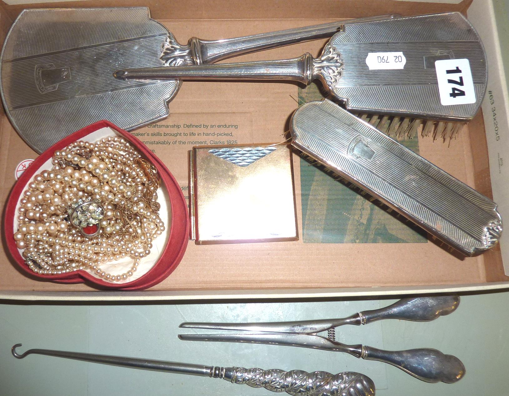 Silver-backed hairbrushes & hand mirror, button hook & glove stretchers, and some costume jewellery