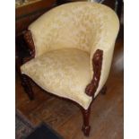 Upholstered tub armchair with carved show-frame