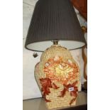 Large Kitsch ceramic table lamp with relief decoration of chrysanthemums over interwoven cane