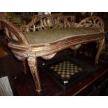 French giltwood window seat with carved foliate openwork back standing on carved legs