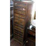 Tall narrow collector's chest of fourteen drawers