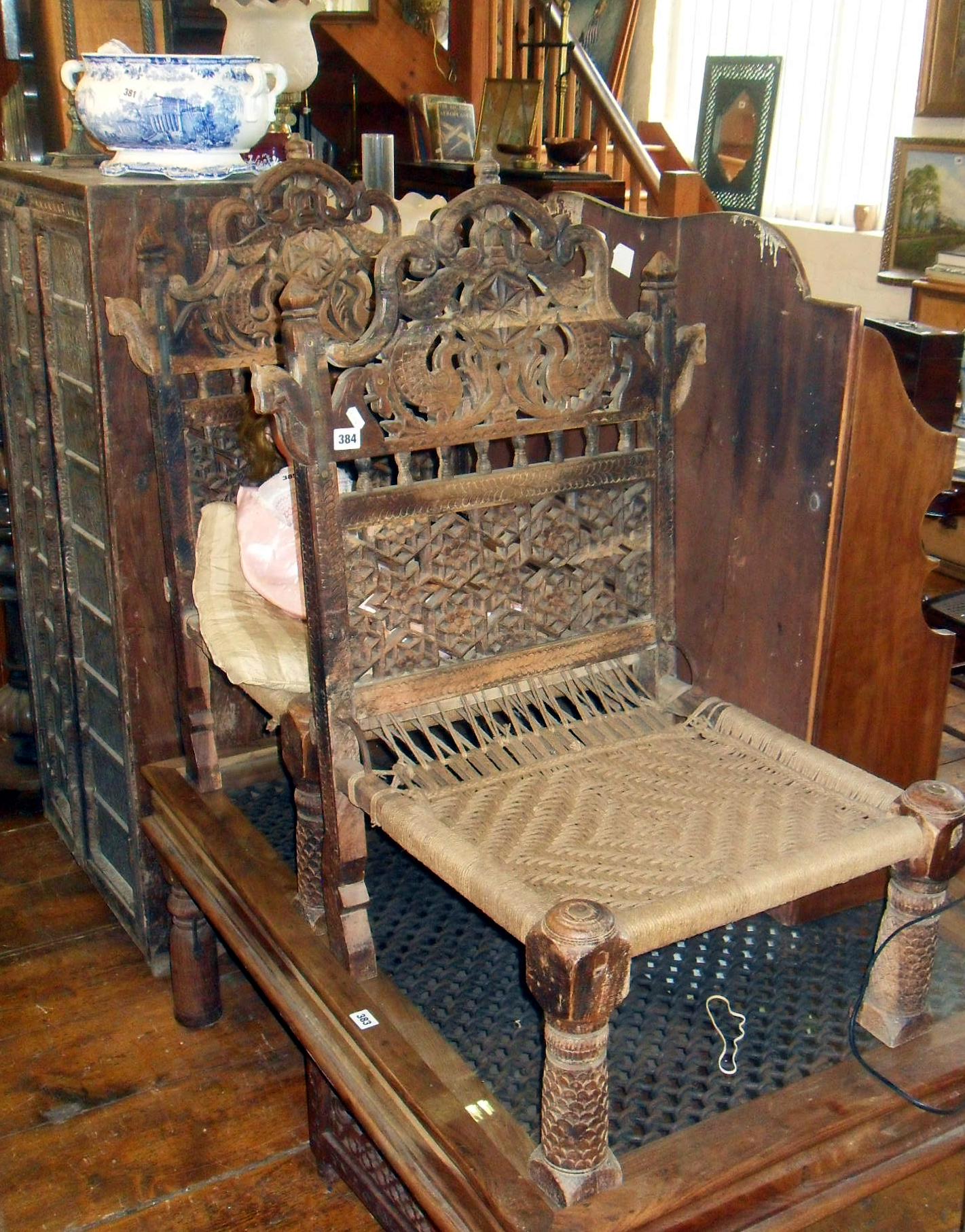 Pair of Indian carved & fretwork hardwood chairs with woven string seats