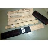 A John Davis & Son celluloid slide rule in leather-covered case
