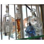 Collection of glass decanters and perfume bottles, including a blue Art Deco scent bottle, and a