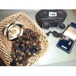 Opera glasses, three brooches and several necklaces