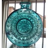 Art glassware:- large disc-shaped blue glass vase decorated with bubbles or lenses in a sun shape.