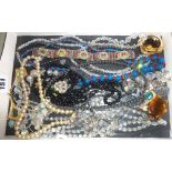 Tray of assorted costume jewellery necklaces, and including a millefiori bracelet