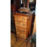 Edwardian mahogany narrow chest of four graduated drawers on cabriole legs