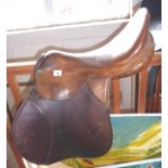 Tan leather saddle made by Barclay & Company