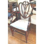 Victorian mahogany open armchair with carved shaped back and fleur de lys detail