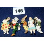 Five vintage miniature pewter jointed figures from Alice in Wonderland (Alice, The Mad Hatter, two