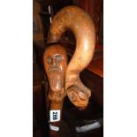 Tribal Art:- walking stick with carved grip of a bearded man, and a 'shepherd's crook' walking stick