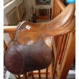 Tan leather saddle made by Barclay & Company
