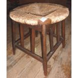 Early 20thC Liberty style rush seated Arts & Crafts round stool. Est. £15 - £20