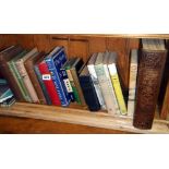 Shelf of assorted books on travel etc