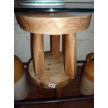 Pair of three-legged elm stools