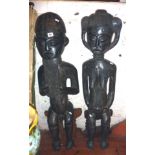 Tribal Art:- large African carved ebony figures of a bearded man and a seated woman with baby on