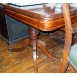 19th c. flame mahogany fold-over tea table on turned central column above four splayed legs with