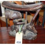Tribal Art:- A Luba headrest with a figure on a long-horned animal