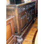 Carved oak dresser base, c.1950's with linenfold panels and standing on carved bulbous feet with '