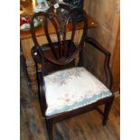 Victorian mahogany open armchair with carved shaped back and fleur de lys detail