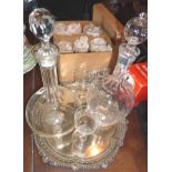 Two glass decanters and a quantity of etched sherry glasses on a silver plated tray