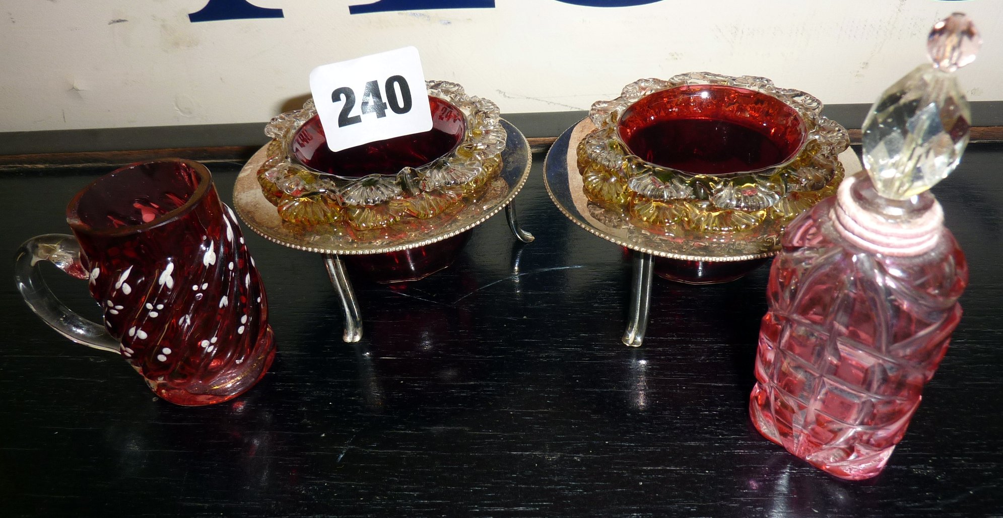Pair of Cranberry glass salts on silver plated stands, a miniature Cranberry glass tankard & cut
