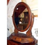 Victorian mahogany oval toilet mirror on shaped platform base with lidded compartment