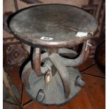 Tribal Art:- an Ibo stool, Nigeria with incised linear decoration, with a central column and eight