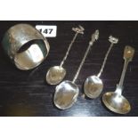 Silver spoons with animal finials, a silver mustard spoon, and a napkin ring