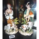 Pair of Continental porcelain figures with crossed swords mark to base