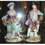 Pair of Sitzendorf porcelain figurines of seated male & female with flute & tambourine