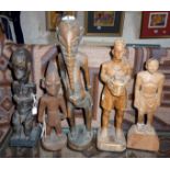 Tribal Art:- Five figures - an elephant man from Eastern Africa, a seated figure, a Yoruba figure