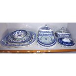 Quantity of blue & white china including meat platters and food covers (one shelf)