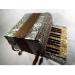 A Hess accordion green marble finish, th