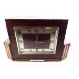 A wooden cased mantel clock with pendulu