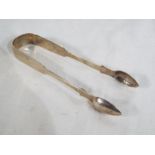 A pair of hallmarked silver sugar tongs,