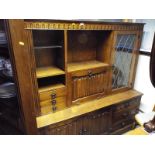 A good quality carved oak cabinet by JC