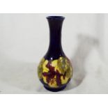 A Moorcroft Pottery solifleur vase decor