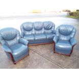 A Damasco three seater dark blue leather