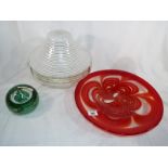 A large art glass bowl in shades of red
