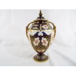Royal Crown Derby - a covered, twin-handled globular urn-shaped vase decorated in the Imari pattern,