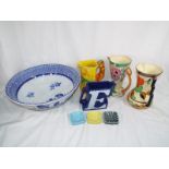 A good collection of ceramics to include three hand painted decorated jugs by Wade Heath,