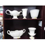 A collection of cream floral ceramic vases and display bowls by Wedgwood,