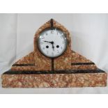A pink and green marble Art Deco styled French mantel clock, white enamel dial with Arabic numerals,