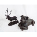 A large heavy good quality Heredities figurine of a Staffordshire bull terrier holding a bone