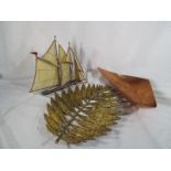 An unusual collection of ornamental metal items to include a sailing ship made from metal and glass,