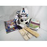 A collection of cricket and football memorabilia to include a collection of football programmes